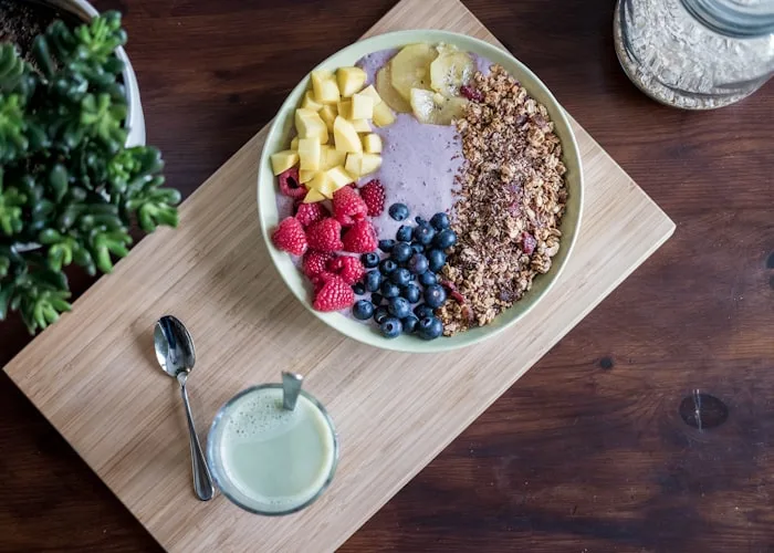 Smoothie bowl topped with granola and berries