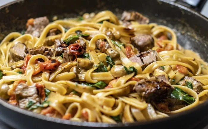Creamy pasta with bacon and herbs